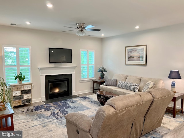 living room with hardwood / wood-style flooring and ceiling fan