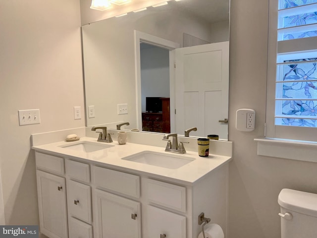 bathroom with vanity and toilet