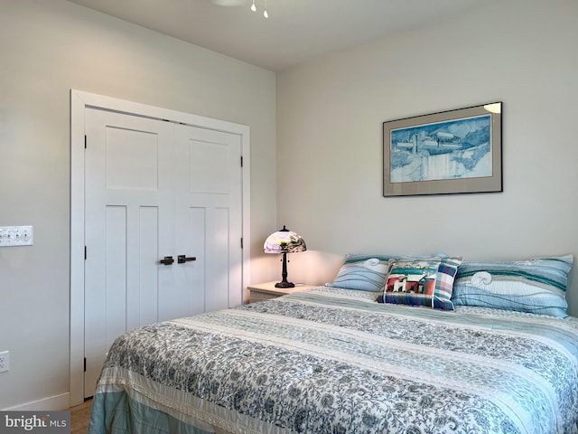 carpeted bedroom featuring a closet