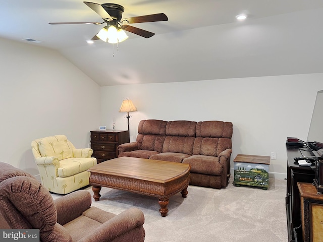 carpeted living room featuring vaulted ceiling and ceiling fan