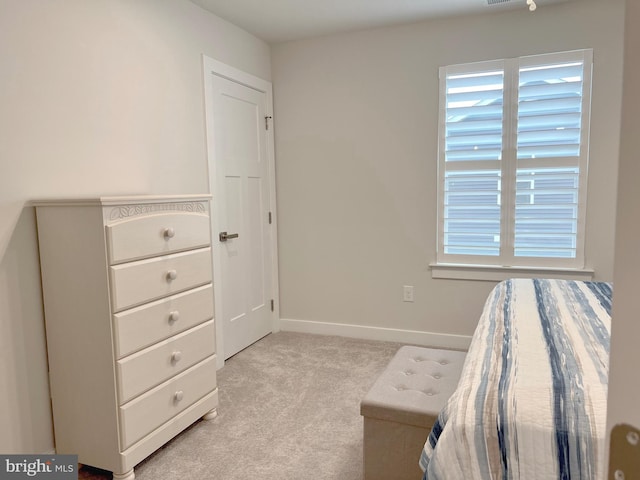 unfurnished bedroom featuring light colored carpet