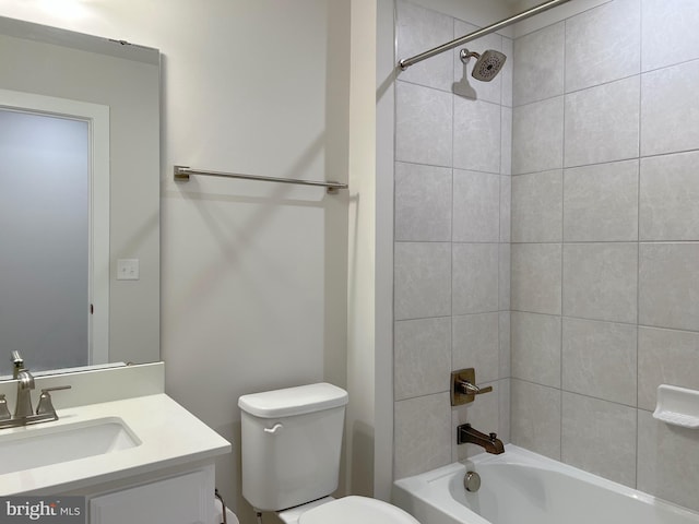 full bathroom featuring vanity, toilet, and tiled shower / bath combo