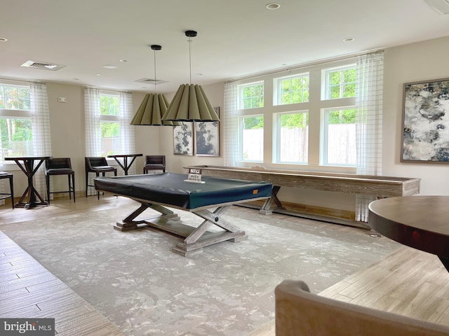 recreation room with billiards and light hardwood / wood-style flooring