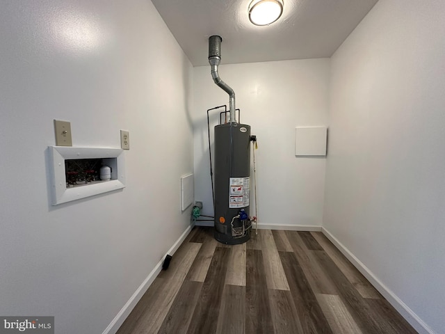 utility room featuring water heater