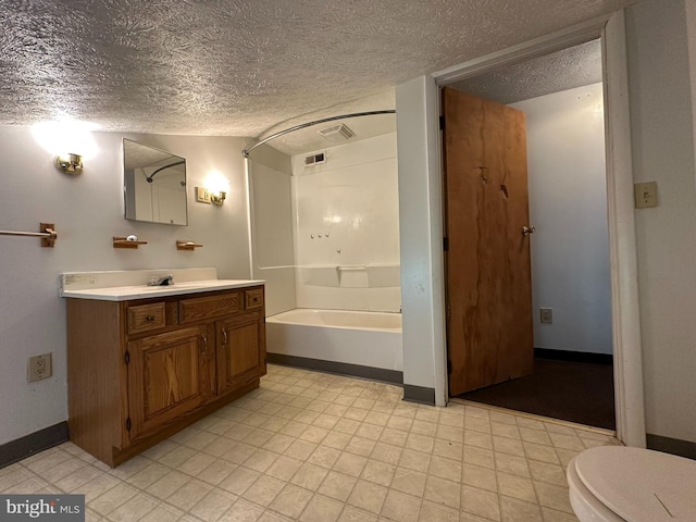 full bathroom featuring toilet, vanity, shower / bath combination, and a textured ceiling