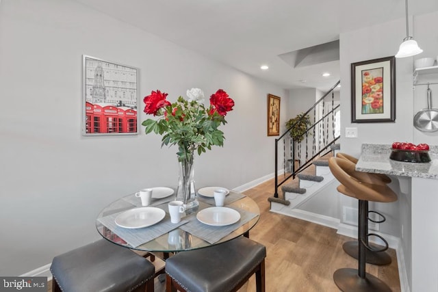 dining space featuring light wood-type flooring