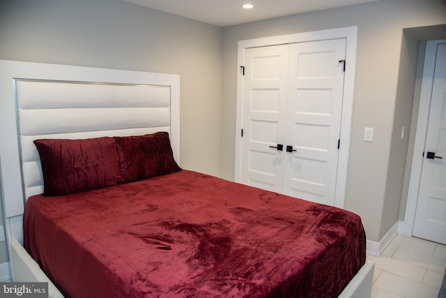 bedroom with light tile patterned floors