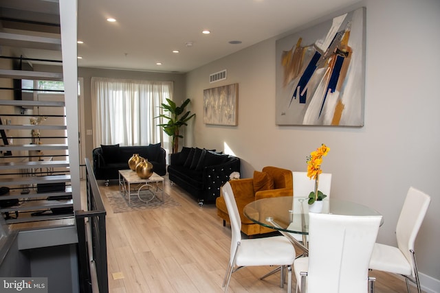 dining room with light hardwood / wood-style flooring