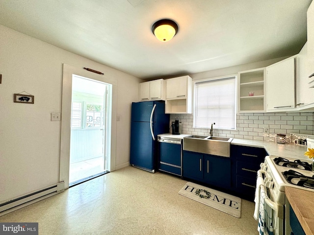 kitchen featuring blue cabinets, white cabinets, dishwashing machine, a baseboard heating unit, and black fridge