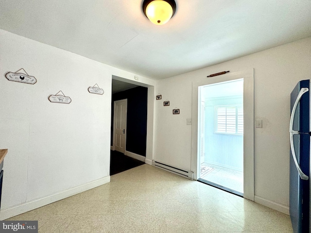 interior space featuring a baseboard heating unit