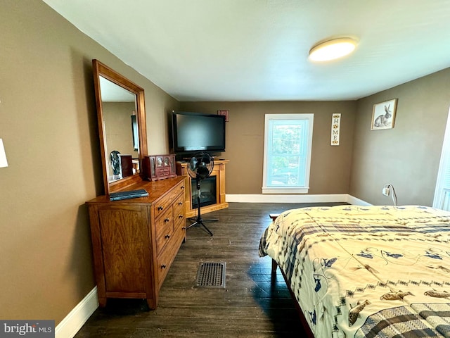 bedroom featuring dark wood-type flooring