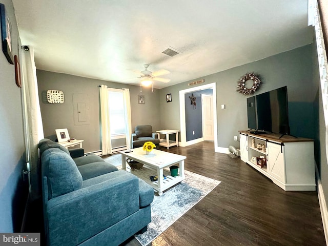 living room with dark wood-type flooring and ceiling fan