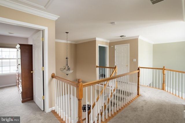 hallway featuring light carpet and ornamental molding