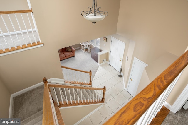 stairs featuring tile patterned flooring