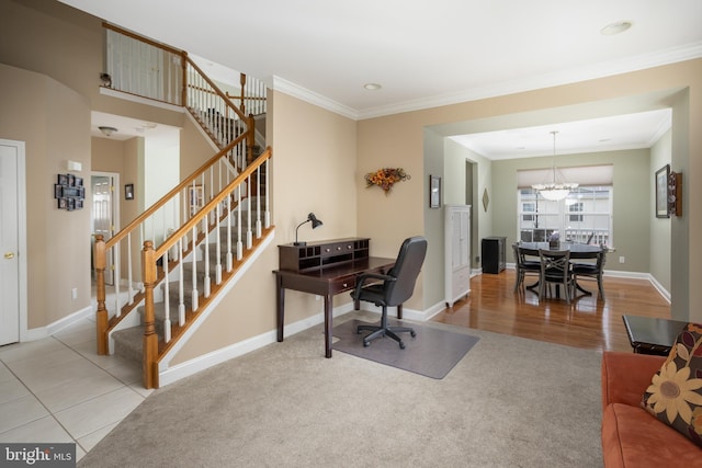 office space featuring crown molding, light tile patterned flooring, and a notable chandelier