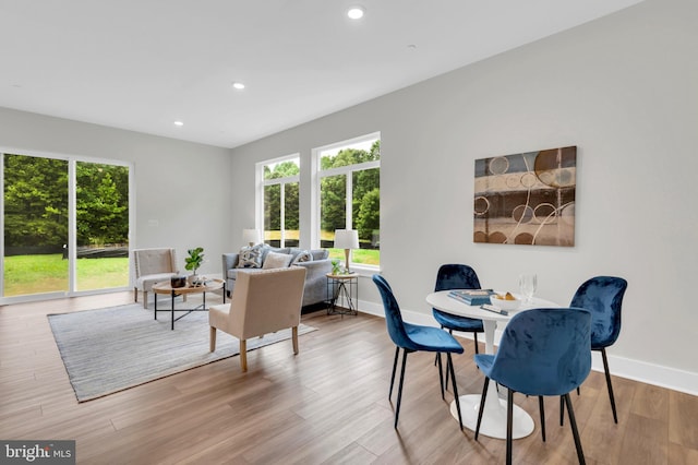 dining space with light wood-type flooring