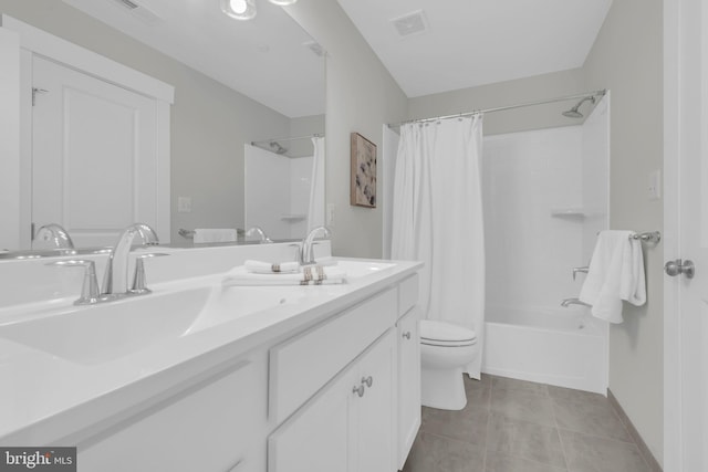 full bathroom featuring tile patterned flooring, toilet, vanity, and shower / tub combo with curtain