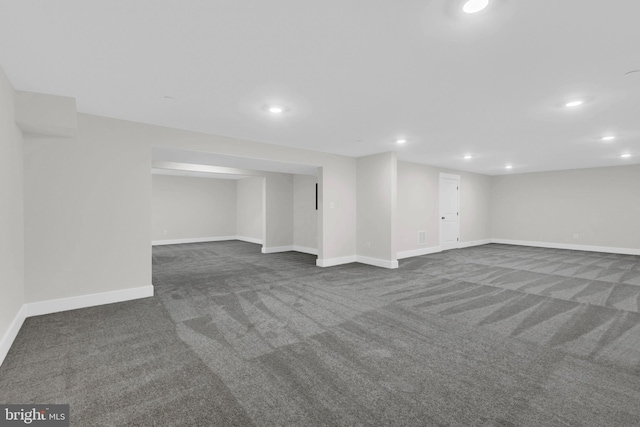 basement with dark carpet