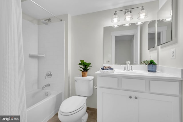 full bathroom with shower / bath combo with shower curtain, toilet, and vanity