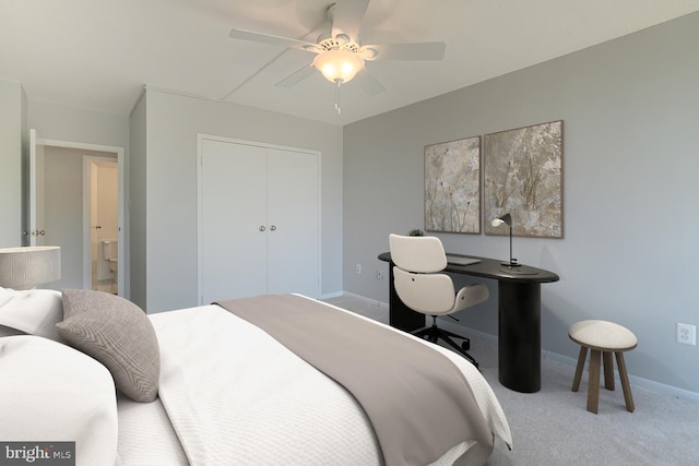 carpeted bedroom featuring ceiling fan, a closet, and baseboards