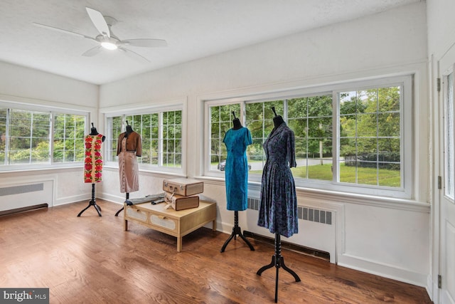 sunroom with radiator heating unit and a wealth of natural light