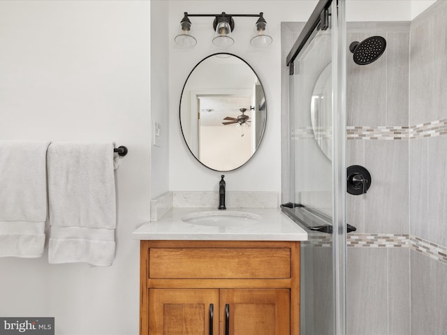 bathroom with vanity and an enclosed shower