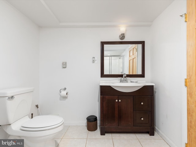 bathroom featuring vanity, tile patterned flooring, and toilet