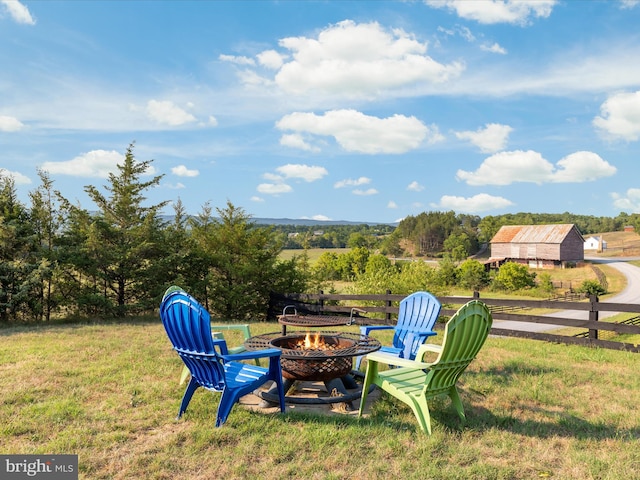 view of yard with an outdoor fire pit