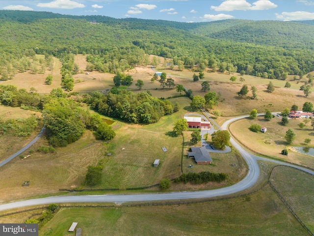 birds eye view of property with a rural view