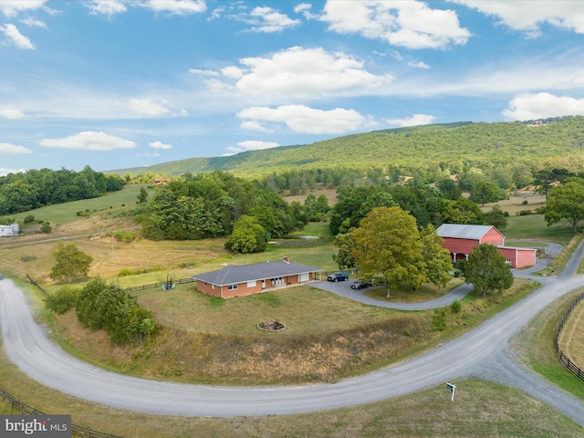 birds eye view of property with a rural view