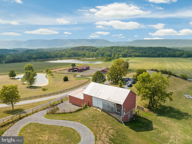 aerial view with a water and mountain view and a rural view