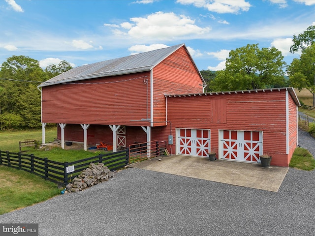 view of outbuilding featuring a yard