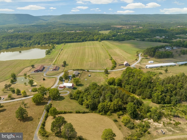 aerial view with a water and mountain view and a rural view