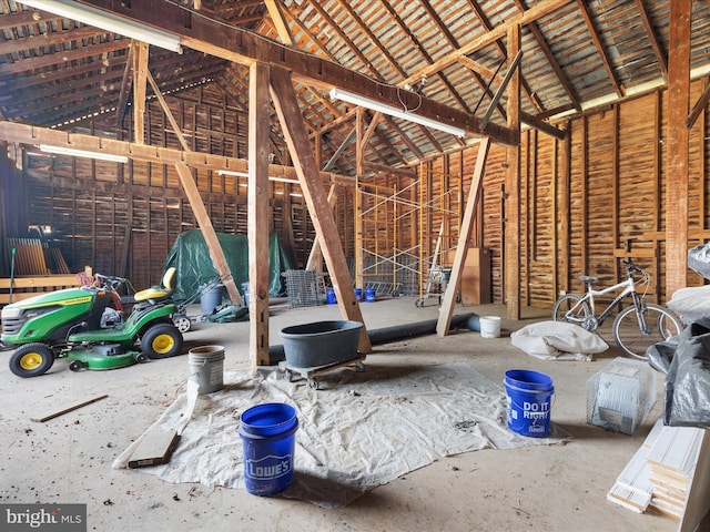 miscellaneous room with high vaulted ceiling