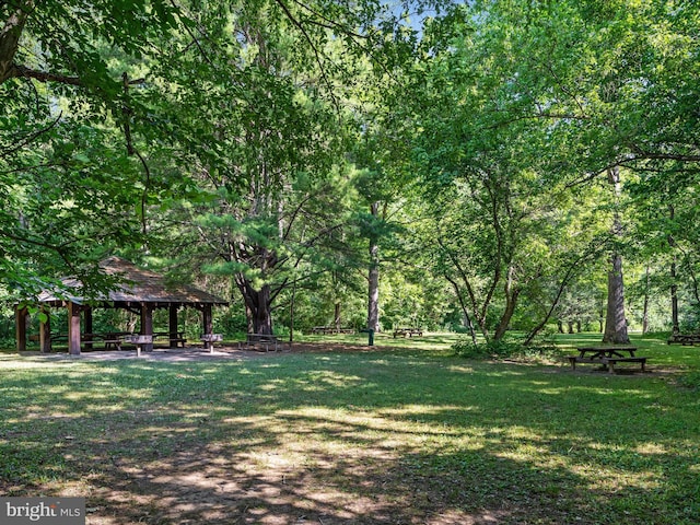 surrounding community featuring a gazebo and a yard