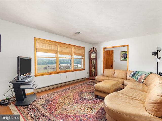 living room featuring hardwood / wood-style flooring and baseboard heating