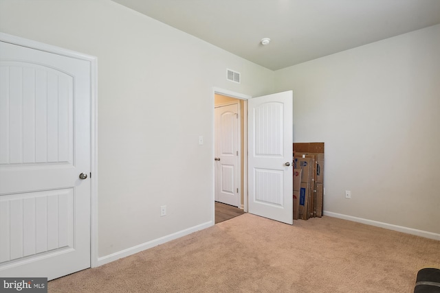 unfurnished bedroom featuring carpet flooring