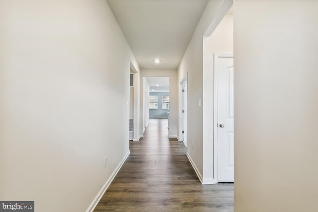 hall with dark wood-type flooring