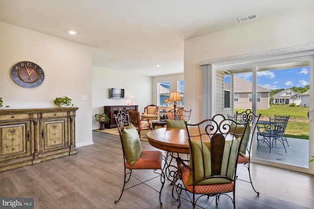 dining area with hardwood / wood-style floors