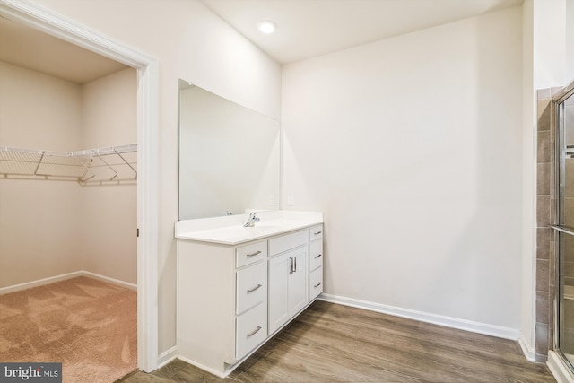 bathroom with vanity and an enclosed shower