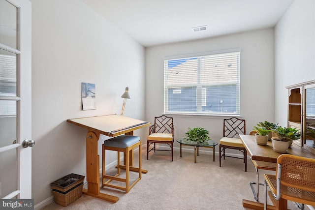 living area featuring light colored carpet