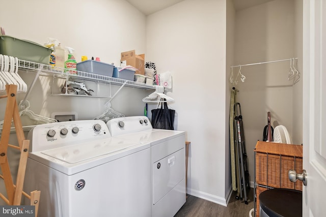 washroom featuring washing machine and dryer and dark hardwood / wood-style flooring