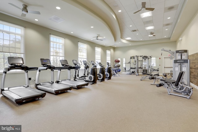 exercise room with a drop ceiling and ceiling fan