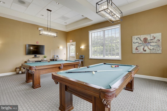 recreation room with light carpet, billiards, and a tray ceiling