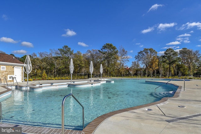 view of pool featuring a patio area