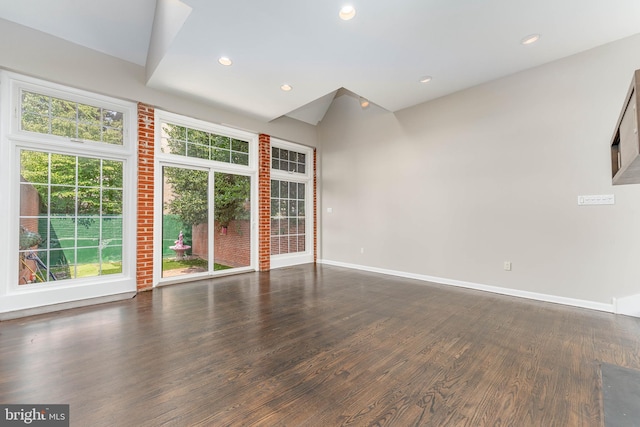 spare room featuring dark wood-type flooring