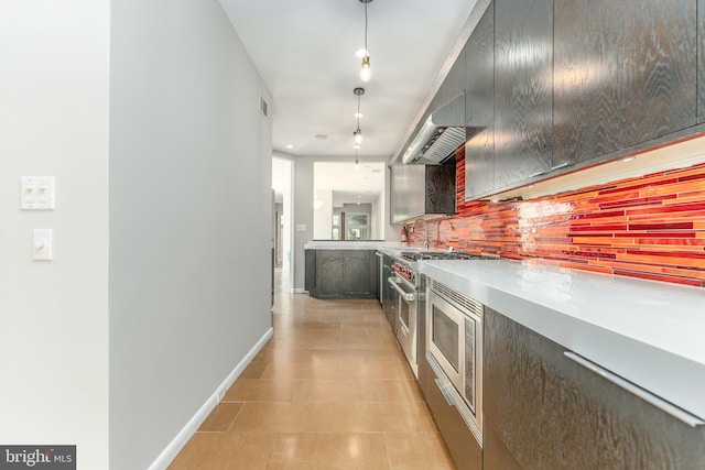 hallway featuring light tile patterned floors and sink