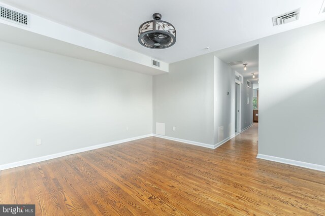 unfurnished room featuring wood-type flooring