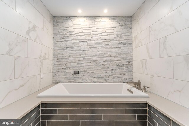 bathroom featuring tile walls