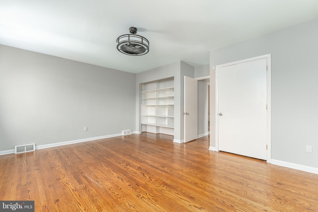 unfurnished bedroom featuring light wood-type flooring